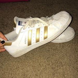Gold adidas superstars
